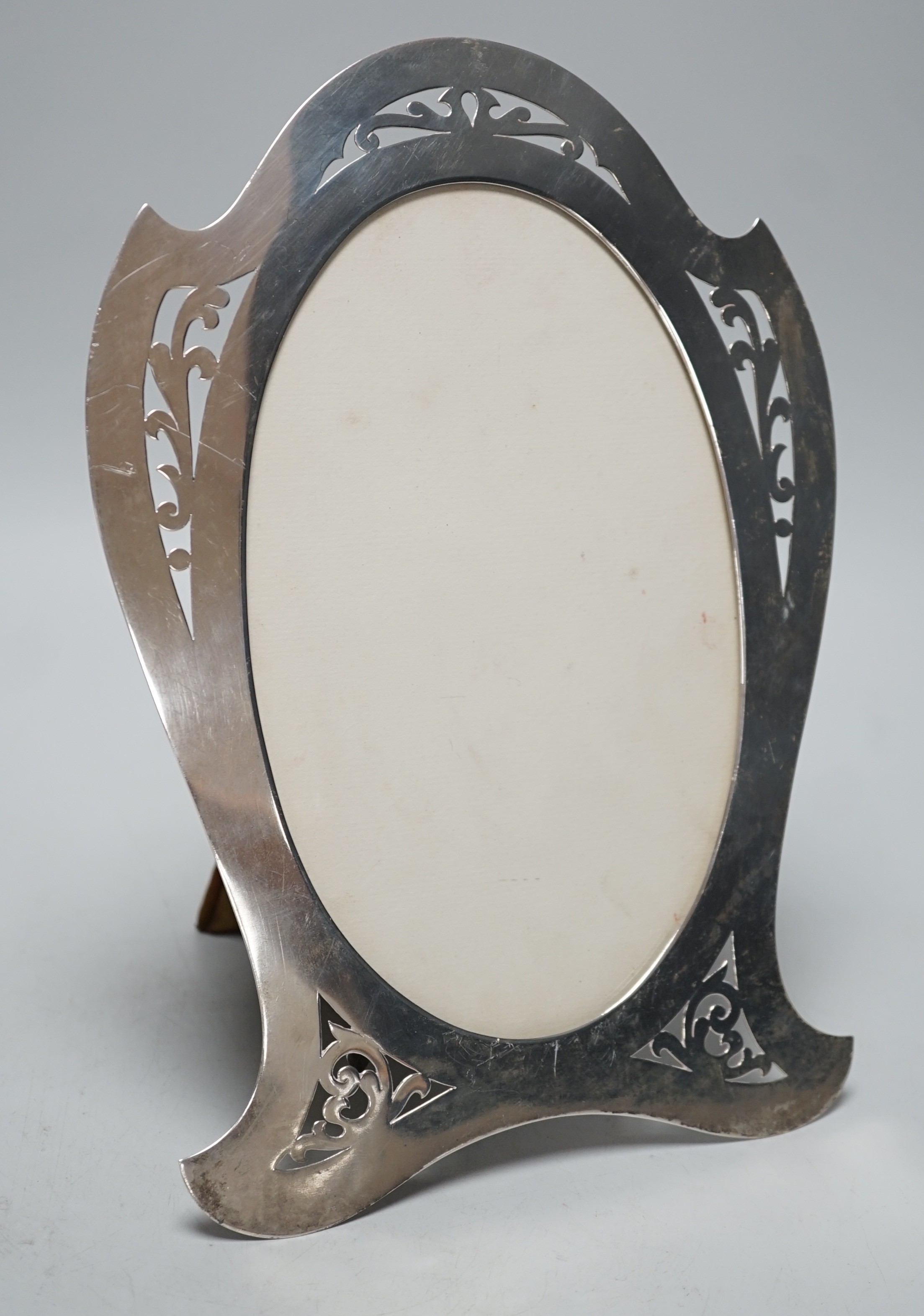 A stylish Edwardian pierced silver mounted photograph frame, Lawrence Emanuel, Birmingham, 1909, 27cm.